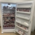 Half cow, approximately 250 pounds of beef, from Nadig Farms neatly packaged and stored in an upfront freezer ready for pickup or delivery.